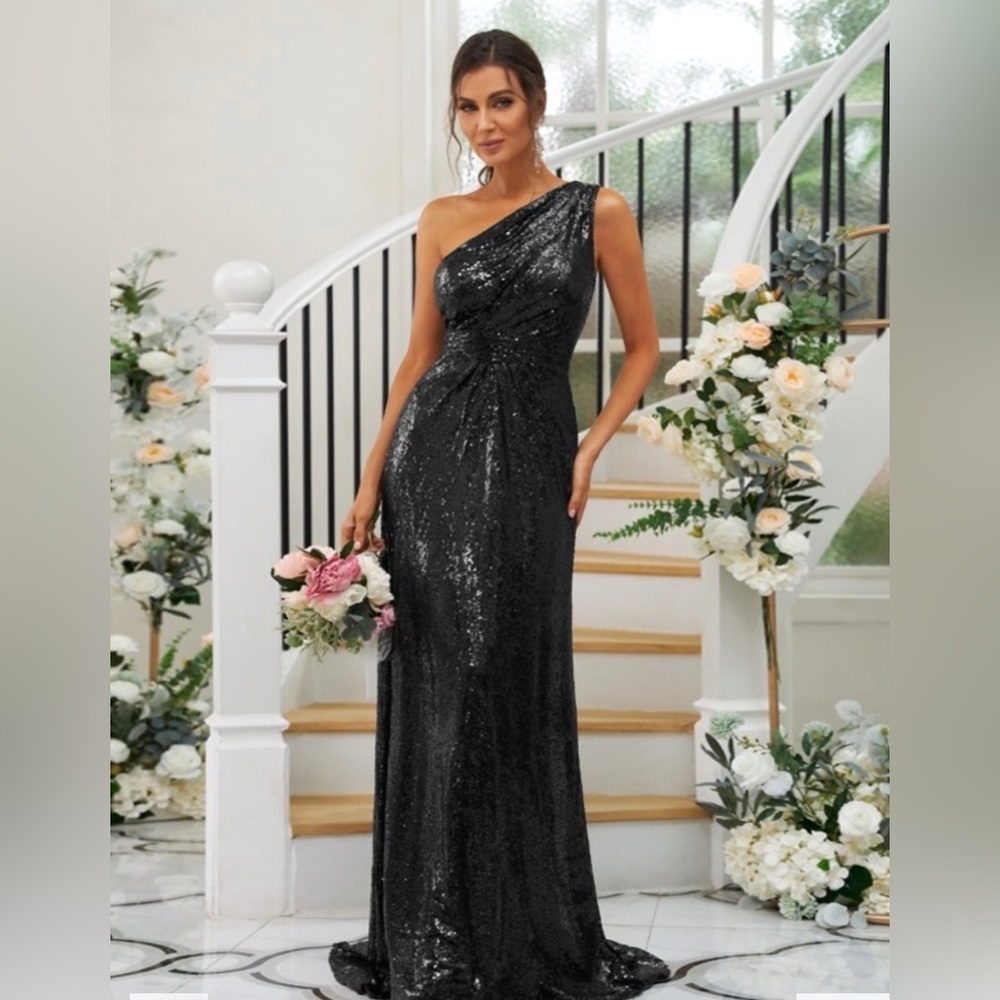 Black sequin one shoulder floor length gown. Never worn still has tags.